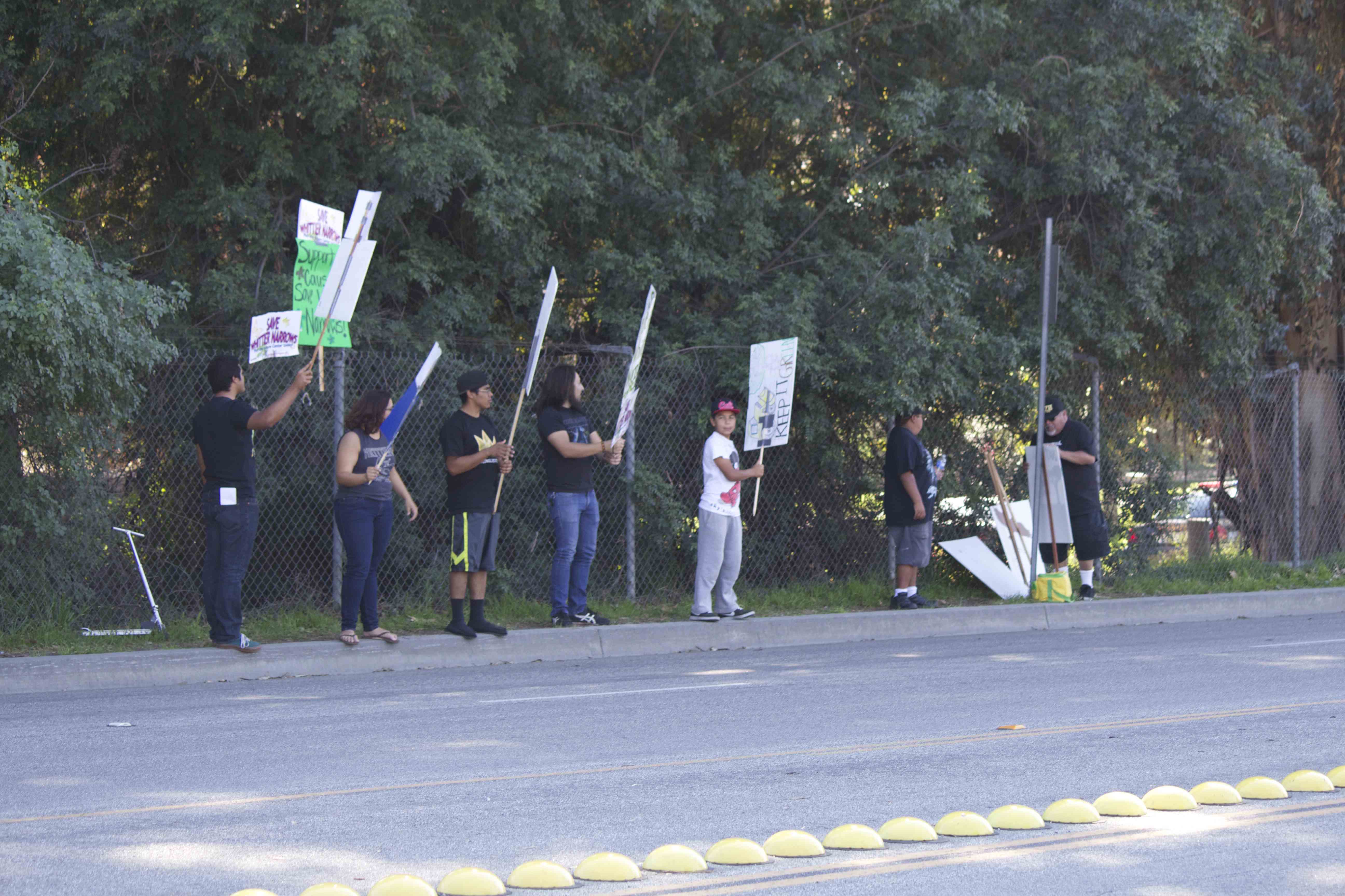 Young protester holding a sign at Whittier Narrows